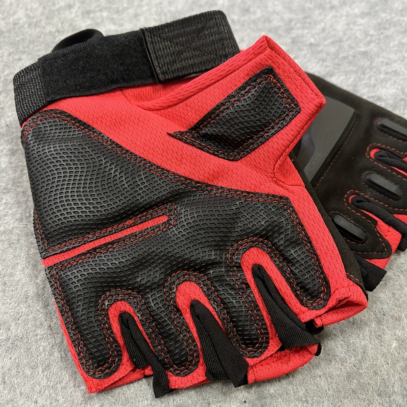 Pair of men's and women's half-finger sports gloves.