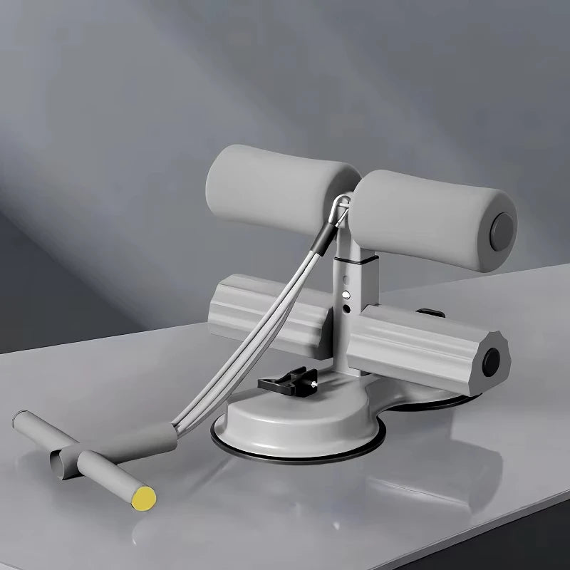 Appareil d’abdominaux avec ventouse et support de chevilles .